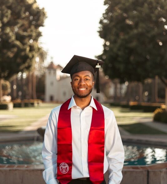 Malachi Finn wearing grad hat