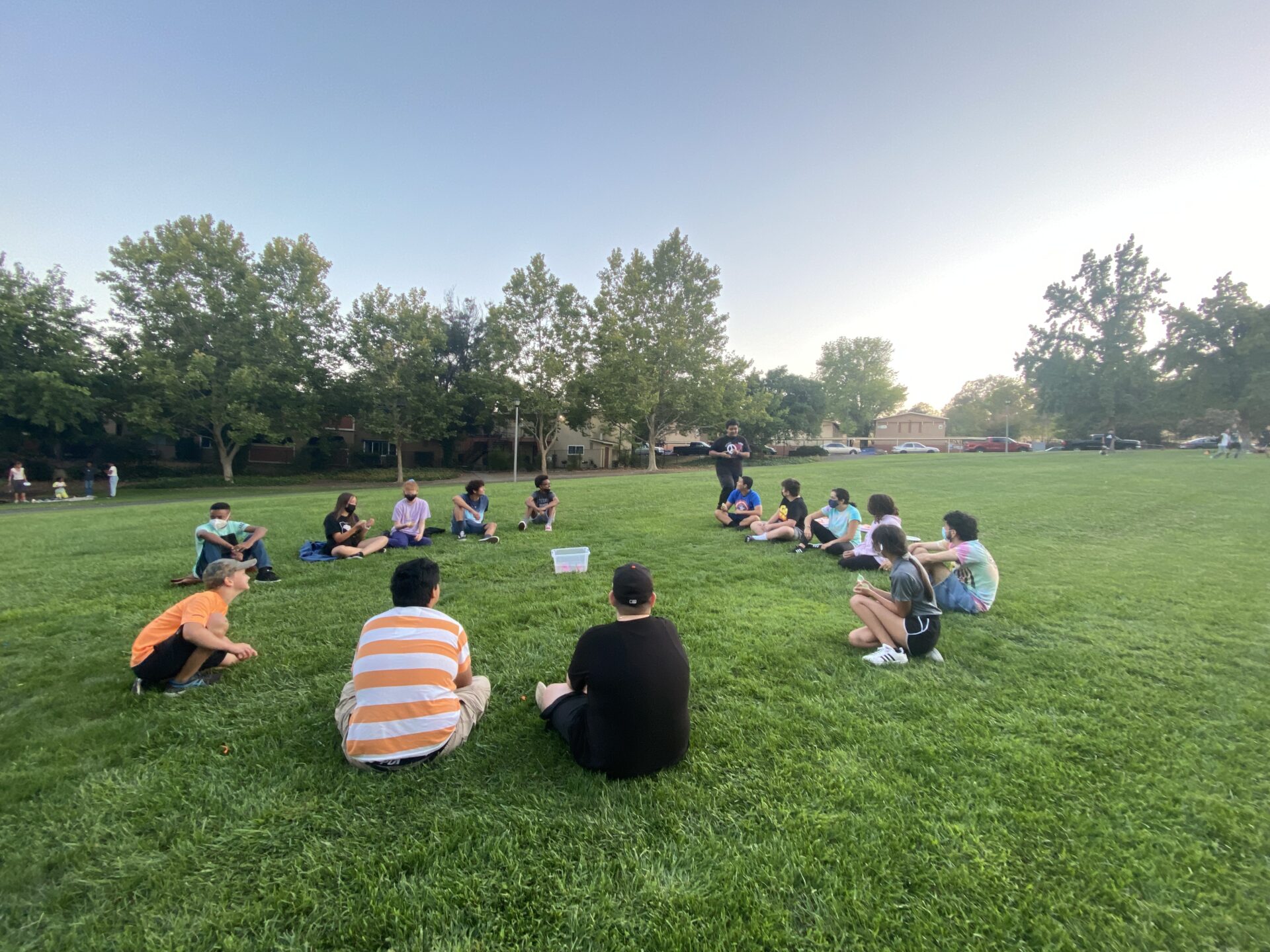 PACT UB Vacaville students sitting on lawn